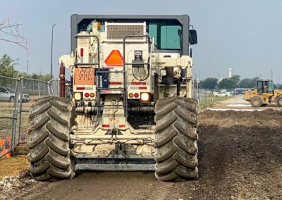 Reclaimer performing soil stabilization for a construction project.