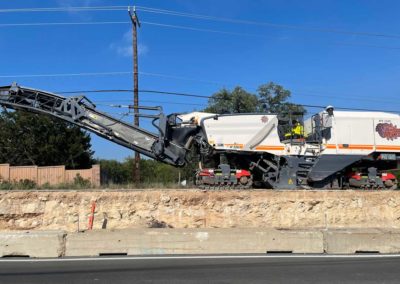 Milling machine on an elevated roadway.